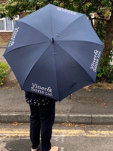 Blue umbrella with Viner & Sons logo on it