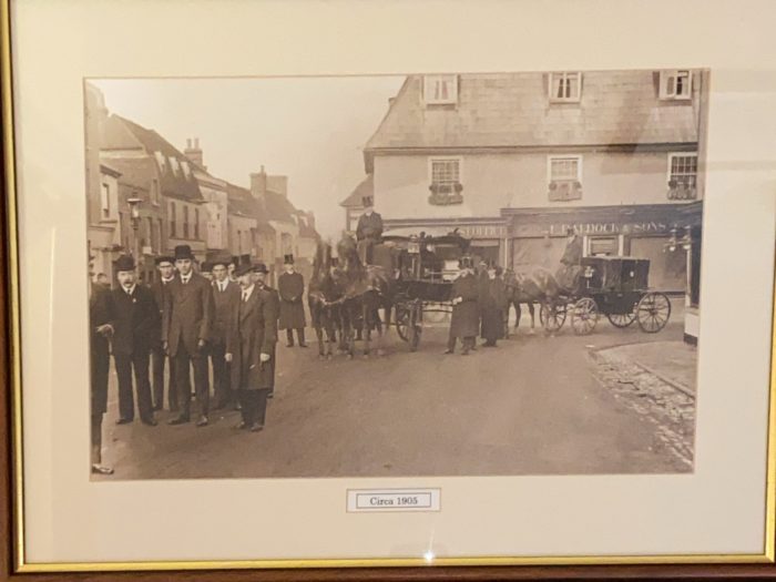 Black and white picture depicting a funeral procession in the past